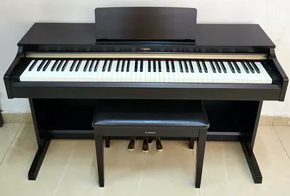 The Yamaha Arius YDP-162R (Dark Rosewood finish) is a high-quality, 88-key digital console piano