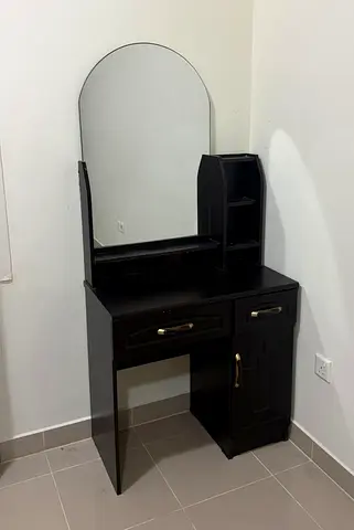 Dark wood dressing table with mirror and storage