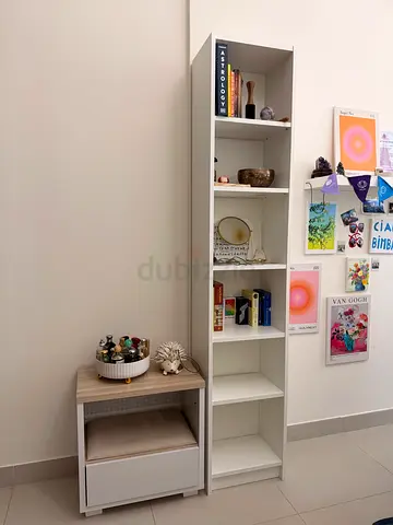 White tall shelving unit with lower cabinet and drawer - good condition