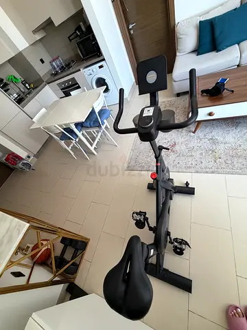 Used Upright Exercise Bike with Adjustable Seat and Handlebars