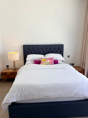 Queen bed frame with upholstered headboard and storage underneath ( in very good condition)