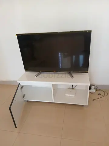 TV CABINET  ALONG WITH BRANDED TV FROM HAIER . BOTH TOGETHER.
