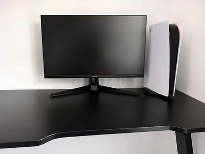 Gaming desk alongside gaming chair
