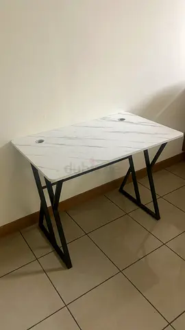 Compact marble-top study desk with cable grommets