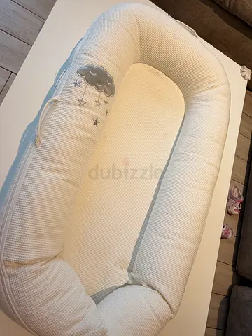 Baby nest lounger / portable infant sleeper - white, gently used