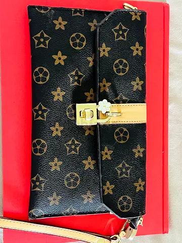 LV brown monogram clutch bag with detachable strap