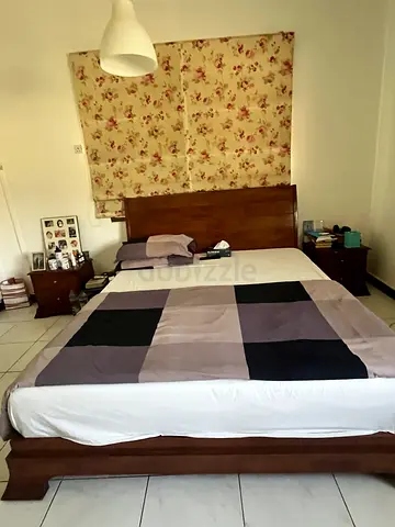 Queen wooden bed frame with matching bedside tables - good condition from the One