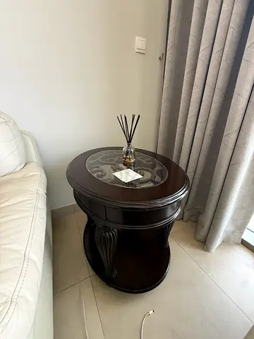 Round dark wood side/end table with glass inset — good condition