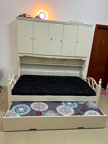 Queen Bed with built in 5 door cabinet bookshelf and with pull out trundle bed