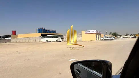 For sale: Fenced land in Al Sajaa, on Public Road 97 and Road 60.