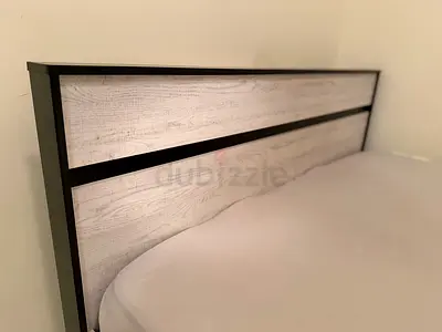 Queen-size bed frame with mattress