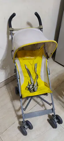 Lightweight yellow umbrella stroller in good used condition