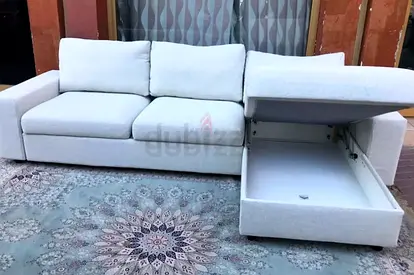 Light grey 3-seater sofa with storage chaise