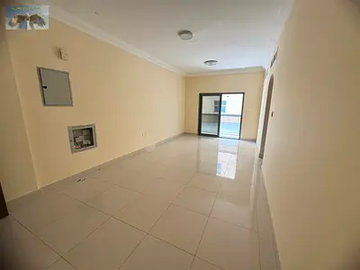 Two bedrooms and a living room with a balcony, central air conditioning, second tenant in Al Jurf