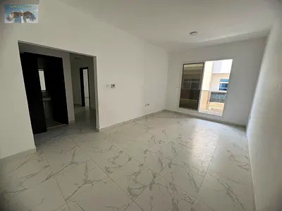 Two bedrooms and a living room with a balcony, two master bedrooms in Al Jurf