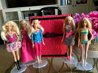 5 Barbie dolls with wardrobe