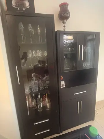 2 Dark wood glass-front display cabinets with drawers