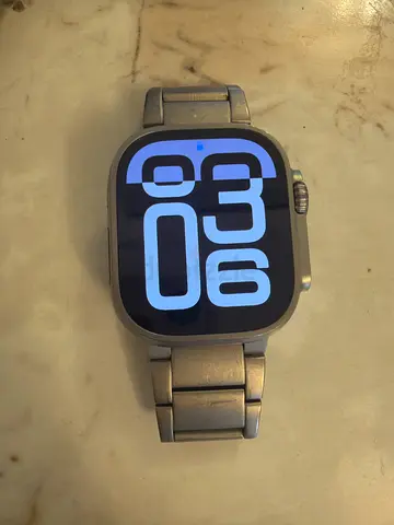 Apple Watch Ultra Titanium Case, 49mm, stainless steel band.