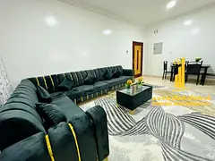 Luxury two-bedroom apartment with a living room and balcony. Ajman, Al Muwaihat 3. Fully furnished.