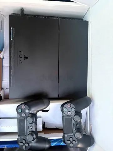 Sony PlayStation 4 Slim with 2 DualShock 4 Controllers - Good Working Condition