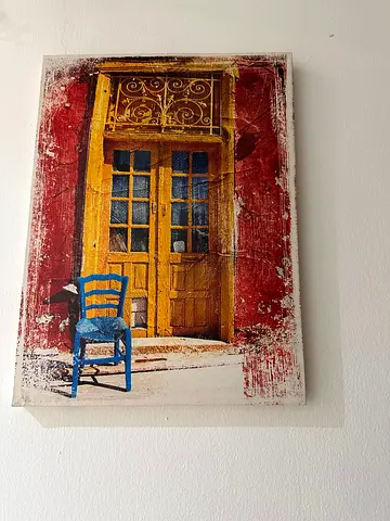 Framed Canvas Print of Yellow Door with Blue Chair
