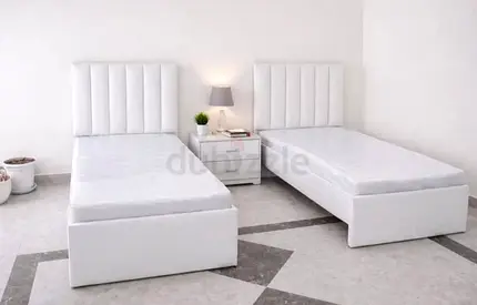 Pair of White Single Beds with Headboards and Storage Bases