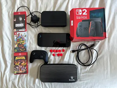 Nintendo Switch V2 console with dock, Pro Controller, games and accessories
