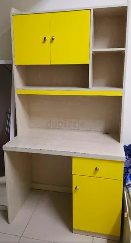 Compact study desk with overhead storage and yellow accents