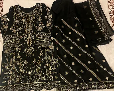 Latest trendy dress.Black Embroidered heavy Pakistani dress with short shirt and plazo.