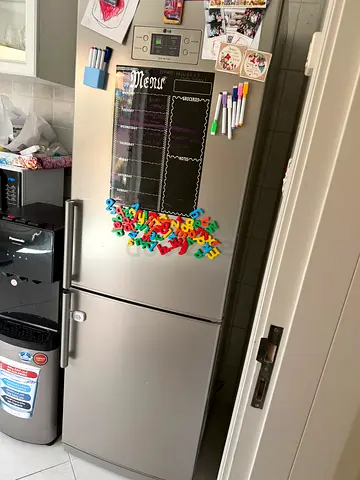 Large double-door stainless steel refrigerator - good working condition