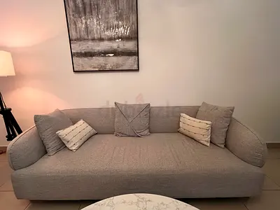 Light grey living room in very good condition and centre marble table