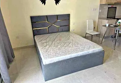 Modern Gray Fabric Bed with Gold Detailing