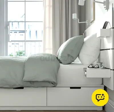 White bed with frame and attachable side tables