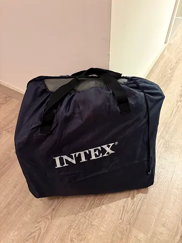 Intex queen-size air mattress with built‑in pump, in excellent condition. Used only a few times.
