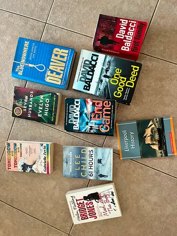 Mixed paperback fiction and non-fiction book lot including David Baldacci, Lee Child, Paula Hawkins
