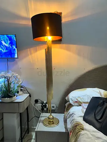 Tall gold floor lamp with black shade - modern elegant design