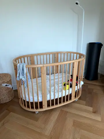 Oval Wooden Baby Crib / Bassinet with a mattress in Good Condition