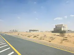 Commercial land for sale in Sharjah, Rawdat Al Qurt area, Al Ruwaidat suburb.