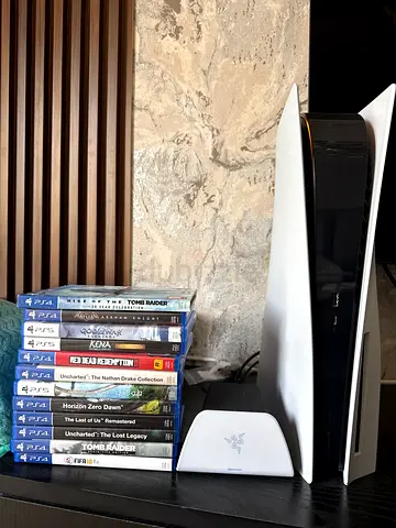 PS5 Disc Edition with extra controllers,Charging station and games!