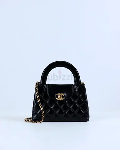 Authentic Chanel Kelly Bag Shiny Aged Calfskin  Gold-Tone Metal in Black Medium size
