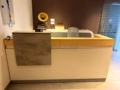 Modern reception desk with wooden top and white body - excellent condition