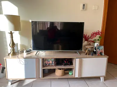 Light wood TV stand / entertainment unit with storage - good condition