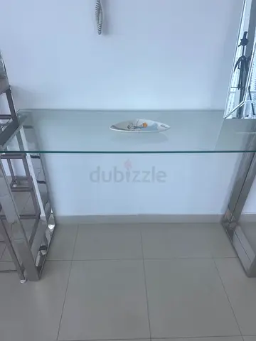 One Glass Top Stainless Steel  Side Table - Excellent Condition. Worth 500 AED.