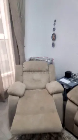 Beige single recliner armchair in good used condition