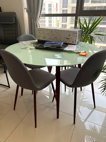 Glass Top Dining Table with 4 Grey Upholstered Chairs