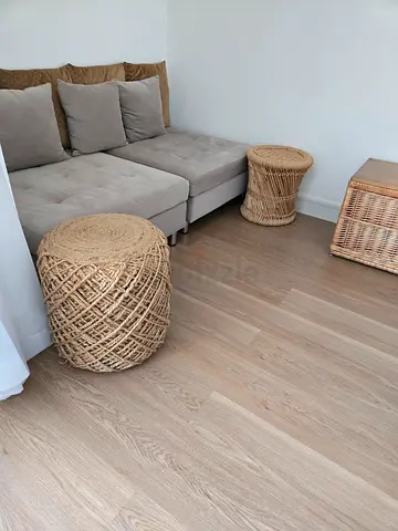 Two rattan poufs and a storage chest