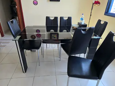 Glass Top Dining Table with 6 Black Chairs - Good Condition