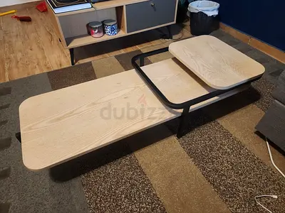 Modern two-tier wooden coffee table with black metal frame