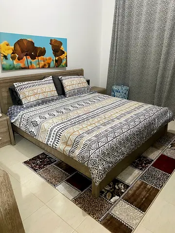 Queen bed frame with mattress.