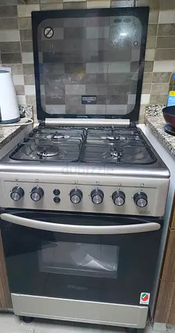 One year old super general 4-Burner Gas Stove with Oven the oven is never used
